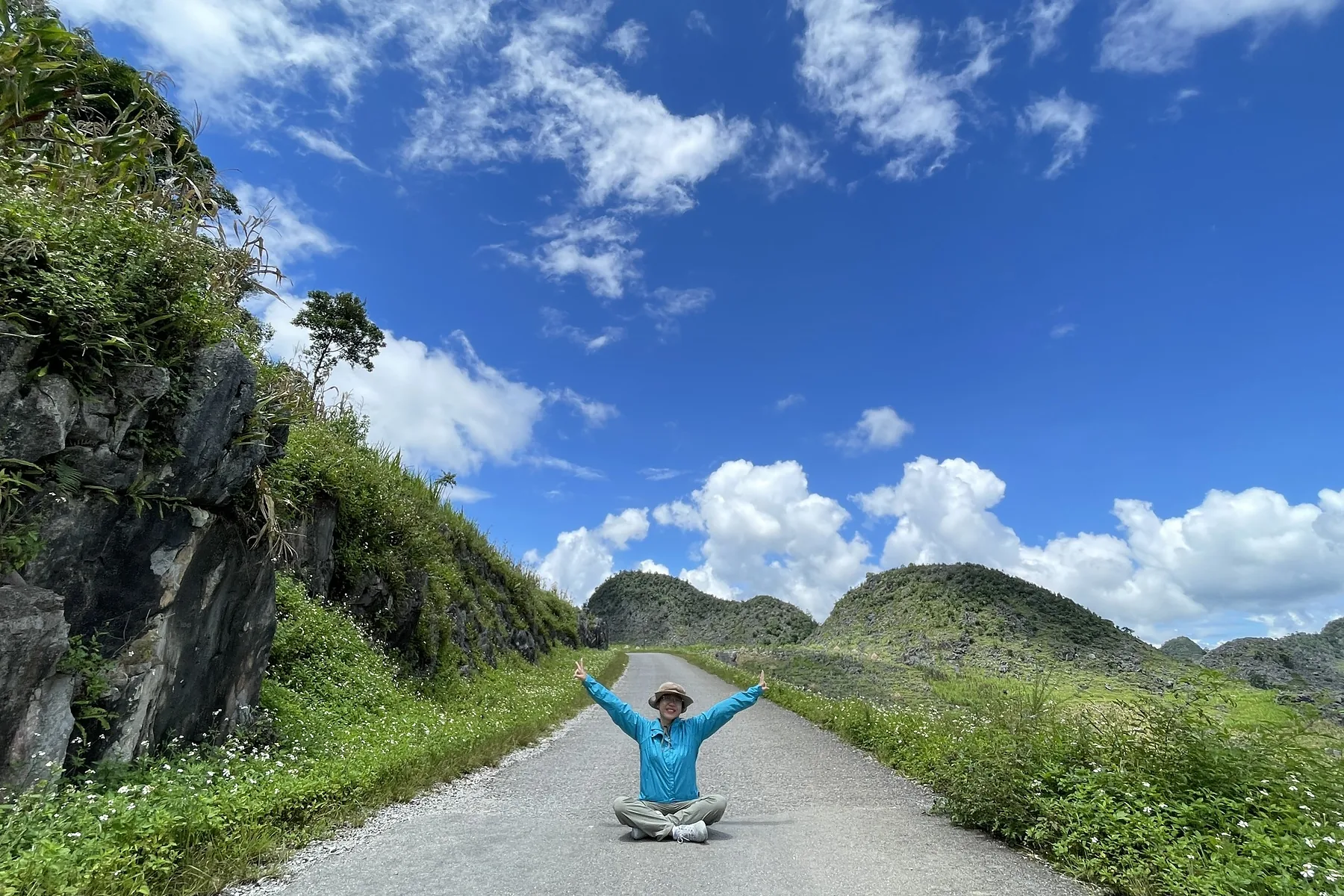Ha Giang mountain road under clear skies during the rainy season