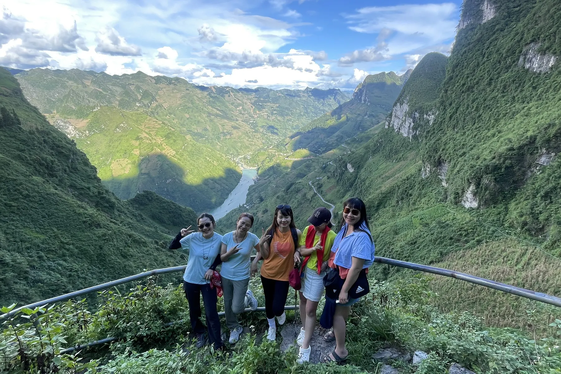 Small Pai Adventure group taking a rest on a Ha Giang mountain route