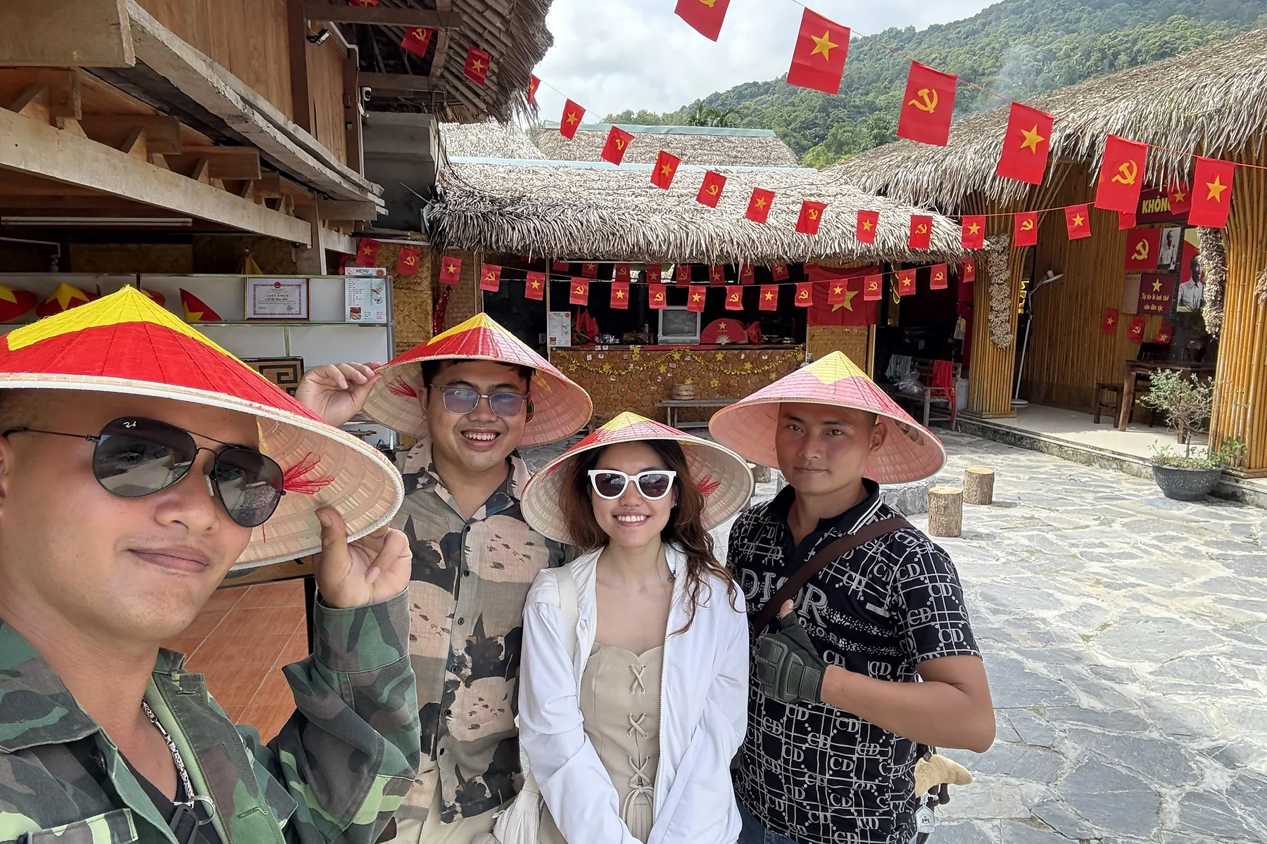 Travellers visiting a highland cultural stop during a Ha Giang journey