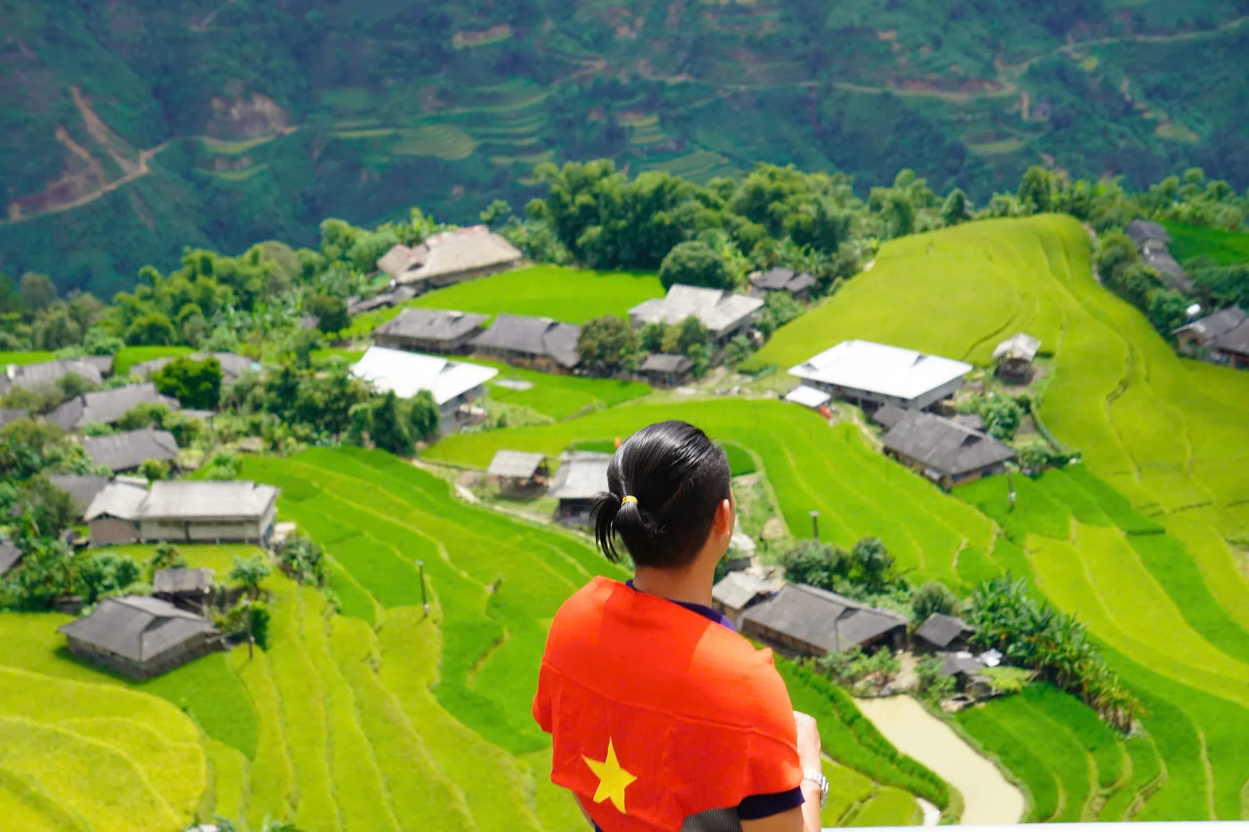 Village set among green rice terraces in western Ha Giang